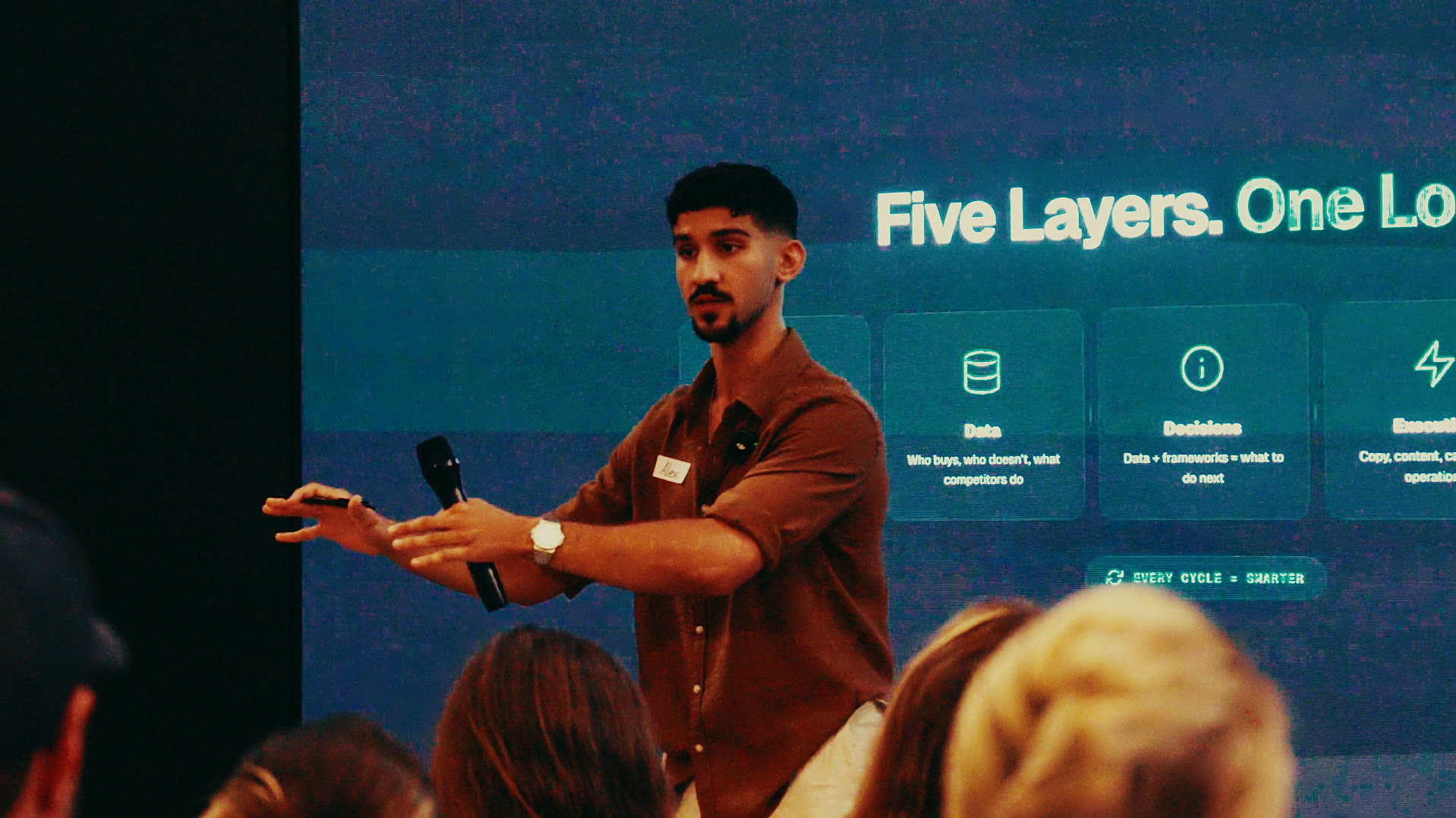 Alexander Kaymakanov speaking on stage
